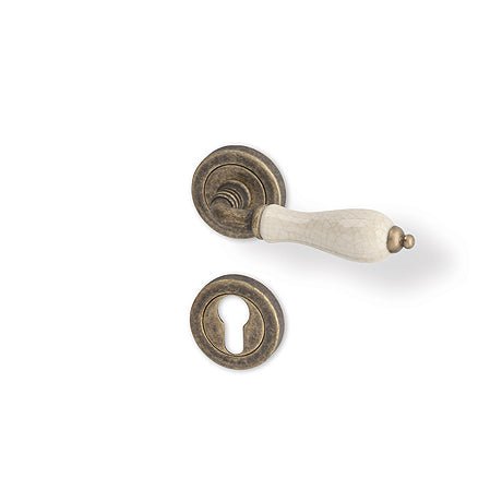 Antik R - Bronze matt patina/ Porzellan - Türgriff auf runder Rosette