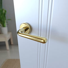 Lea KLE G00 Messing - Türgriff auf runder Rosette