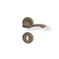 Rustik R - matt bronze patina - Door Handle on a Round Rose
